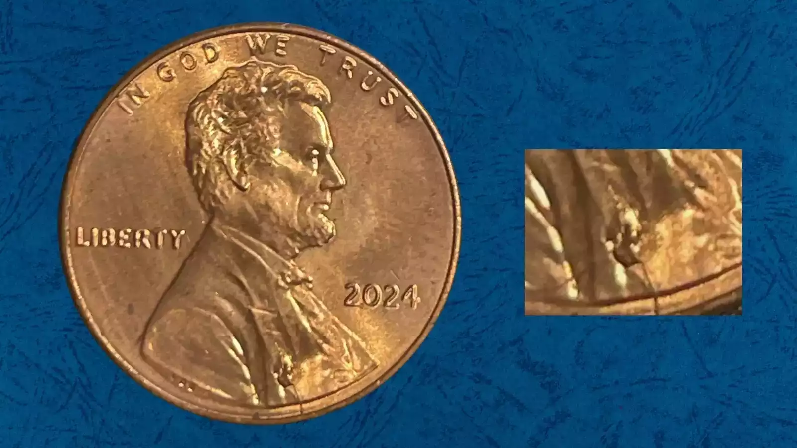 2024-D penny retained die break cud error showing raised blob-like metal mass at rim